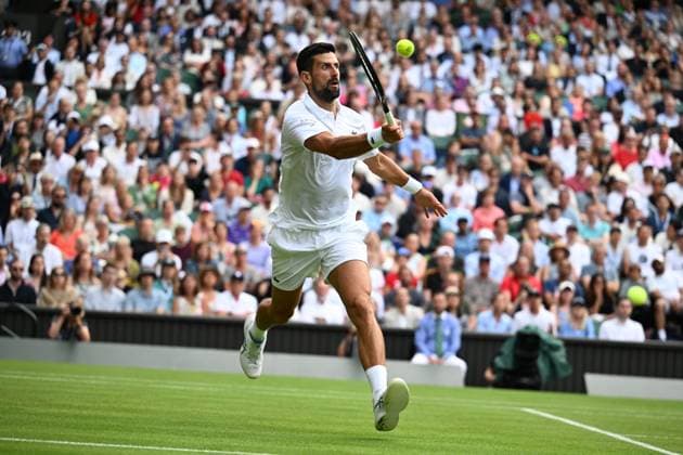 (250706) -- LONDON, July 6, 2025 -- Novak Djokovic hits a return during the men s singles third round match between Novak Djokovic of Serbia and Miomir Kecmanovic of Serbia at the Wimbledon Tennis Championships in London, Britain, July 5, 2025. ) (SP)BRITAIN-LONDON-TENNIS-WIMBLEDON-MEN S SINGLES ZhaoxDingzhe 
