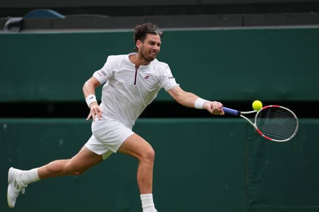 LONDON, ENGLAND - JULY 06: Cameron Norrie of Great Britain plays a shot during the Gentlemen s Singles fourth round match on day seven of The Championships Wimbledon 2025 at All England Lawn Tennis and Croquet Club on July 06, 2025 in London, England.  Copyright: xHiroshixSatox