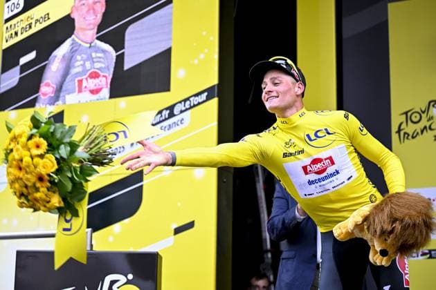 Dutch Mathieu van der Poel of Alpecin-Deceuninck celebrates on the podium in the yellow jersey of leader in the overall ranking after the second stage of the 2025 Tour de France cycling race, from Lauwin-Planque to Boulogne-sur-Mer (212 km), on Sunday 06 July 2025 in France. The 112th edition of the Tour de France starts on Saturday 5 July in Lille, and will finish in Paris on the 27th of July. DAVIDxPINTENS  x128548371x
