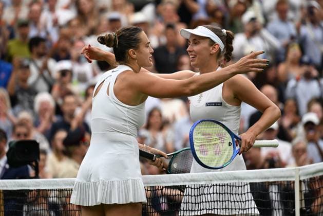 (250707) -- LONDON, July 7, 2025 -- Aryna Sabalenka (L) greets Elise Mertens after the women s singles fourth round match between Aryna Sabalenka of Belarus and Elise Mertens of Belgium at the Wimbledon Tennis Championships in London, Britain, July 6, 2025. ) (SP)BRITAIN-LONDON-TENNIS-WIMBLEDON-WOMEN S SINGLES ZhaoxDingzhe 