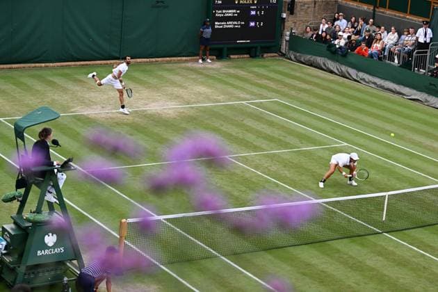 (250707) -- LONDON, July 7, 2025 -- Jiang Xinyu Yuki Bhambri (L) compete during the mixed doubles second round match between Zhang Shuai (China) Marcelo Arevalo (El Salvador) and Jiang Xinyu (China) Yuki Bhambri (India) at the Wimbledon Tennis Championships in London, Britain, July 6, 2025. ) (SP)BRITAIN-LONDON-TENNIS-WIMBLEDON-MIXED DOUBLES ZhaoxDingzhe 