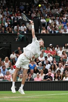 (250707) -- LONDON, July 7, 2025 -- Andrey Rublev serves during the men s singles fourth round match between Carlos Alcaraz of Spain and Andrey Rublev of Russia at the Wimbledon Tennis Championships in London, Britain, July 6, 2025. ) (SP)BRITAIN-LONDON-TENNIS-WIMBLEDON-MEN S SINGLES ZhaoxDingzhe 