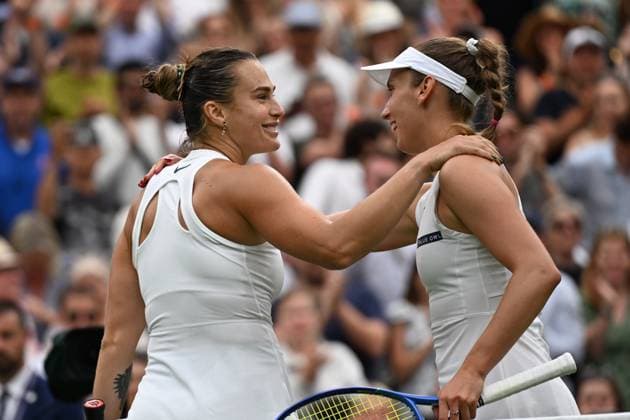 (250707) -- LONDON, July 7, 2025 -- Aryna Sabalenka (L) greets Elise Mertens after the women s singles fourth round match between Aryna Sabalenka of Belarus and Elise Mertens of Belgium at the Wimbledon Tennis Championships in London, Britain, July 6, 2025. ) (SP)BRITAIN-LONDON-TENNIS-WIMBLEDON-WOMEN S SINGLES ZhaoxDingzhe 