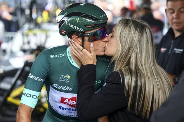 Belgian Jasper Philipsen of Alpecin-Deceuninck wearing the green jersey and his partner Melanie Peetermans pictured at the start of the third stage of the 2025 Tour de France cycling, from Valenciennes to Dunkerque (178 km) on Monday 07 July 2025 in France. The 112th edition of the Tour de France starts on Saturday 5 July in Lille, France, and will finish in Paris, France on the 27th of July. JASPERxJACOBS  x128592258x