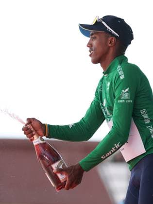 (250707) -- XINING, July 7, 2025 -- Solomon Henok Mulueberhan of XDS Astana Team celebrates in the green jersey on the podium after Stage 2 of the Tour of Magnificent Qinghai International Road cycling, Rad, Radsport, Strasse Race from Duoba to Huzhu, northwest China s Qinghai Province, July 7, 2025. ) (SP)CHINA-QINGHAI-CYCLING-TOUR OF MAGNIFICENT QINGHAI-STAGE 2 (CN) ZhangxLong 