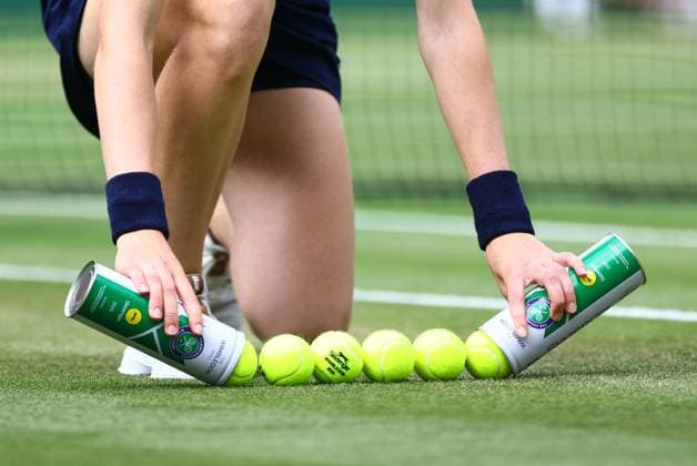 A ball kid collects tennis balls during the Belinda Bencic v Ekaterina Alexandrova Round of 16 match Wimbledon Tennis Championships, Day 8, The All England Lawn Tennis and Croquet Club, London, UK - 07 Jul 2025London The All England Lawn Tennis and United Kingdom  Copyright: xJamesxMarsh Shutterstockx 15387973as