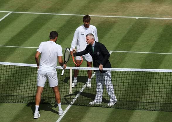 7th July 2025; All England Lawn Tennis and Croquet Club, London, England; Wimbledon Tennis Tournament, Day 8; Umpire shows the coin to Marin Cilic (CRO) and Flavio Cobolli (ITA)  ActionPlus12811150 JohnxPatrickxFletcher
