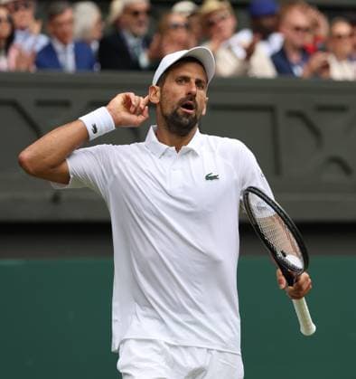 Serbian Novak Djokovic reacts in his fourth round match against Australia s Alex De Minaur on day eight of the 2025 Wimbledon Championships in London on Monday, July 07, 2025.  LON2025070701a HUGOxPHILPOTT