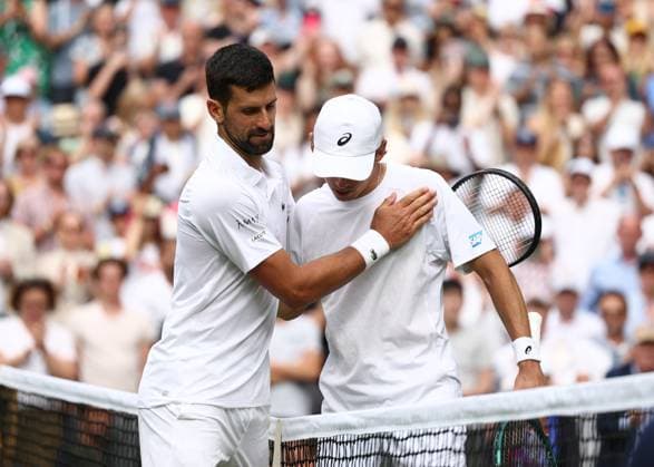 7th July 2025; All England Lawn Tennis and Croquet Club, London, England; Wimbledon Tennis Tournament, Day 8; Novak Djokovic (SRB) consoles Alex de Minaur (AUS) after defeating the Australian 1-6 6-4 6-4 6-4 to book a place in the Gentlemen& x2019;s& xa0;Singles Quarter-finals  ActionPlus12811229 JohnxPatrickxFletcher
