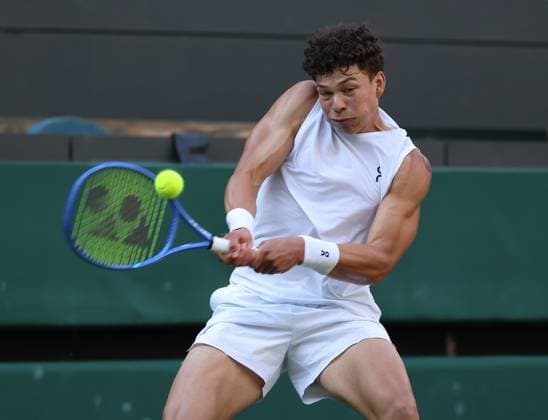 American Ben Shelton plays a backhand in his fourth round match against Italian Lorenzo Sonego on day eight of the 2025 Wimbledon Championships in London on Monday, July 07, 2025.  LON2025070762 HUGOxPHILPOTT