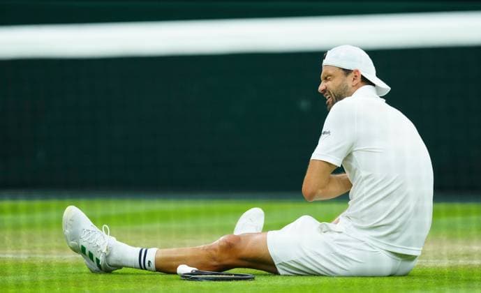 Grigor Dimitrov goes down with an unexpected injury which forced him to retire despite being two sets up against Jannik Sinner Wimbledon Tennis Championships, Day 9, The All England Lawn Tennis and Croquet Club, London, UK - 08 Jul 2025London The All England Lawn Tennis and United Kingdom  Copyright: xJavierxGarcia Shutterstockx 15389334r