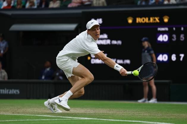 7th July 2025; All England Lawn Tennis and Croquet Club, London, England; Wimbledon Tennis Tournament, Day 8; Jannik Sinner (ITA) with a backhand shot to Grigor Dimitrov (BUL)  ActionPlus12811298 JohnxPatrickxFletcher