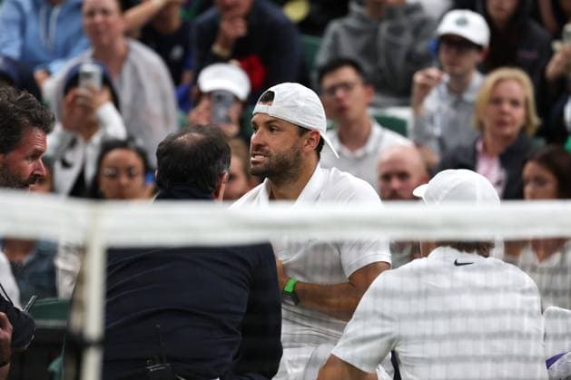 7th July 2025; All England Lawn Tennis and Croquet Club, London, England; Wimbledon Tennis Tournament, Day 8; Grigor Dimitrov (BUL) in severe pain while being seen by the Wimbledon Medical Team after damaging his pectoral muscle from serving to Jannik Sinner (ITA)  ActionPlus12811291 JohnxPatrickxFletcher