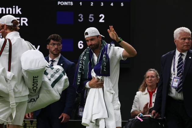 7th July 2025; All England Lawn Tennis and Croquet Club, London, England; Wimbledon Tennis Tournament, Day 8; A visibly upset Grigor Dimitrov (BUL) waving goodbye to the Centre Court crowd followed by his opponent Jannik Sinner (ITA) after damaging his pectoral muscle from serving to Jannik Sinner (ITA)  ActionPlus12811293 JohnxPatrickxFletcher