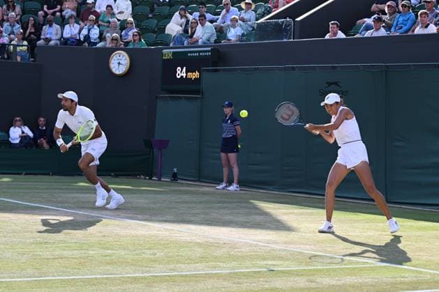 (250708) -- LONDON, July 8, 2025 -- Zhang Shuai (R) Marcelo Arevalo compete during the mixed doubles quarter final match between Zhang Shuai (China) Marcelo Arevalo (El Salvador) and Desirae Krawczyk (USA) Olivia Gadecki (Australia) at the Wimbledon Tennis Championships in London, Britain, July 7, 2025. ) (SP)BRITAIN-LONDON-TENNIS-WIMBLEDON-MIXED DOUBLES ZhaoxDingzhe 