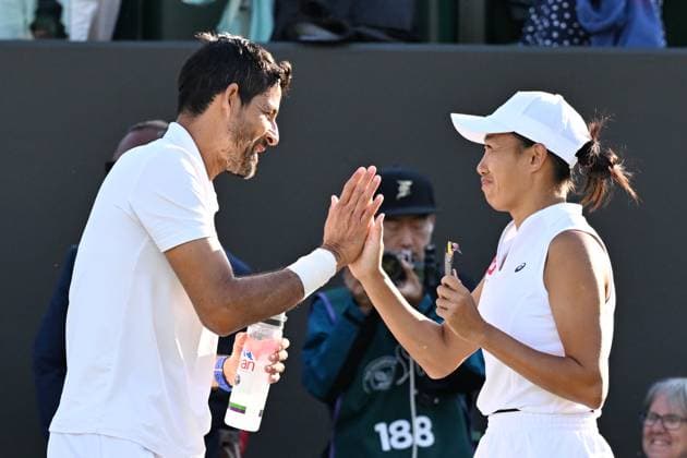 (250708) -- LONDON, July 8, 2025 -- Zhang Shuai (R) celebrates with Marcelo Arevalo after the mixed doubles quarter final match between Zhang Shuai (China) Marcelo Arevalo (El Salvador) and Desirae Krawczyk (USA) Olivia Gadecki (Australia) at the Wimbledon Tennis Championships in London, Britain, July 7, 2025. ) (SP)BRITAIN-LONDON-TENNIS-WIMBLEDON-MIXED DOUBLES ZhaoxDingzhe 