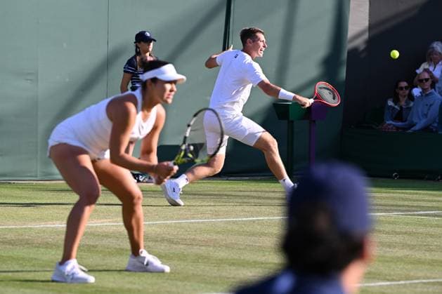 (250708) -- LONDON, July 8, 2025 -- Desirae Krawczyk Olivia Gadecki (R) compete during the mixed doubles quarter final match between Zhang Shuai (China) Marcelo Arevalo (El Salvador) and Desirae Krawczyk (USA) Olivia Gadecki (Australia) at the Wimbledon Tennis Championships in London, Britain, July 7, 2025. ) (SP)BRITAIN-LONDON-TENNIS-WIMBLEDON-MIXED DOUBLES ZhaoxDingzhe 