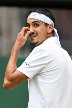 (250708) -- LONDON, July 8, 2025 -- Lorenzo Sonego reacts during the men s singles round of 16 match between Ben Shelton of the United States and Lorenzo Sonego of Italy at the Wimbledon Tennis Championships in London, Britain, July 7, 2025 ) (SP)BRITAIN-LONDON-TENNIS-WIMBLEDON-MEN S SINGLES ZhaoxDingzhe 