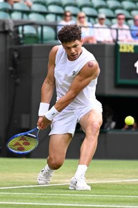 (250708) -- LONDON, July 8, 2025 -- Ben Shelton hits a return during the men s singles round of 16 match between Ben Shelton of the United States and Lorenzo Sonego of Italy at the Wimbledon Tennis Championships in London, Britain, July 7, 2025 ) (SP)BRITAIN-LONDON-TENNIS-WIMBLEDON-MEN S SINGLES ZhaoxDingzhe 