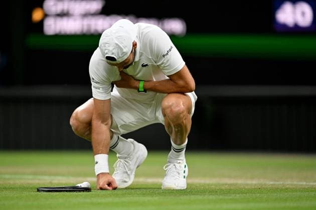 (250708) -- LONDON, July 8, 2025 -- Grigor Dimitrov reacts after getting injured during the men s singles round of 16 match between Grigor Dimitrov of Bulgaria and Jannik Sinner of Italy at the Wimbledon Tennis Championships in London, Britain, July 7, 2025. ) (SP)BRITAIN-LONDON-TENNIS-WIMBLEDON-MEN S SINGLES LixYing 