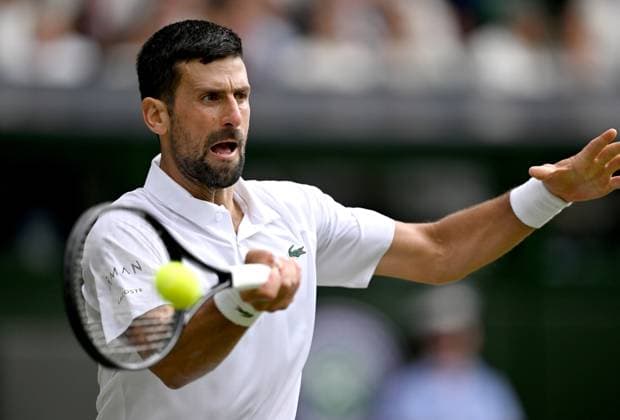 (250708) -- LONDON, July 8, 2025 -- Novak Djokovic hits a return during the men s singles round of 16 match between Novak Djokovic of Serbia and Alex De Minaur of Australia at the Wimbledon Tennis Championships in London, Britain, July 7, 2025. ) (SP)BRITAIN-LONDON-TENNIS-WIMBLEDON-MEN S SINGLES LixYing 