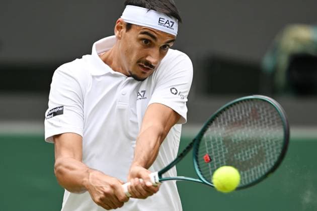 (250708) -- LONDON, July 8, 2025 -- Lorenzo Sonego hits a return during the men s singles round of 16 match between Ben Shelton of the United States and Lorenzo Sonego of Italy at the Wimbledon Tennis Championships in London, Britain, July 7, 2025 ) (SP)BRITAIN-LONDON-TENNIS-WIMBLEDON-MEN S SINGLES ZhaoxDingzhe 