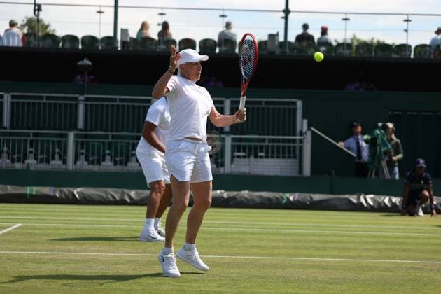 9th July 2025; All England Lawn Tennis and Croquet Club, London, England; Wimbledon Tennis Tournament, Day 10; Martina Navratilova (USA) with a backhand shot to Fabrice Santoro (FRA)9th July 2025; All England Lawn Tennis and Croquet Club, London, England; Wimbledon Tennis Tournament, Day 10; Martina Navratilova (USA) with a backhand shot to Fabrice Santoro (FRA) in her mixed doubles match  ActionPlus12811567 JohnxPatrickxFletcher