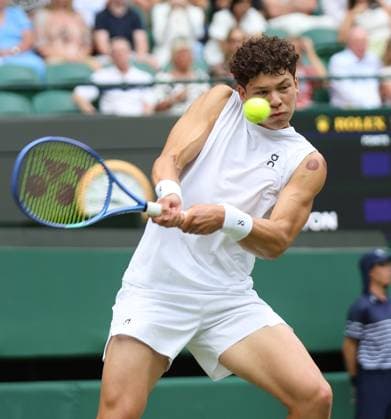 American Ben Shelton plays a backhand in his Quarter-Final match against Italian Jannik Sinner on day ten of the 2025 Wimbledon Championships in London on Wednesday, July 09, 2025.  LON2025070950 HUGOxPHILPOTT