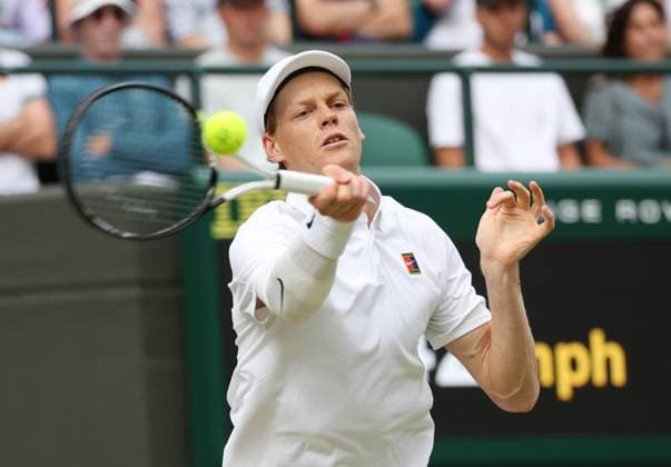 Italian Jannik Sinner plays a backhand in his Quarter-Final match against American Ben Shelton on day ten of the 2025 Wimbledon Championships in London on Wednesday, July 09, 2025.  LON2025070957 HUGOxPHILPOTT