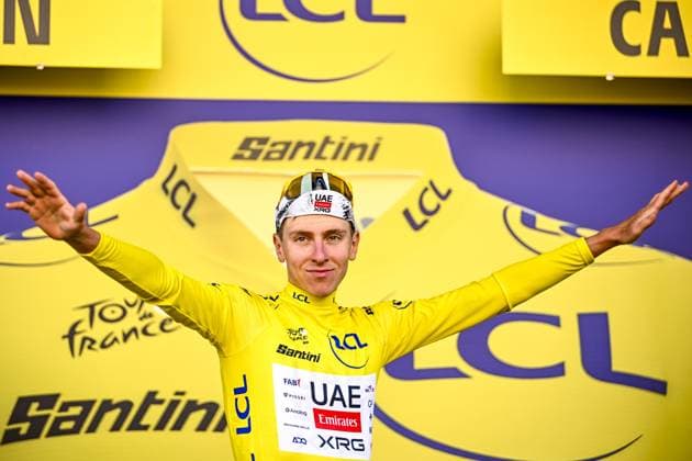 Slovenian Tadej Pogacar of UAE Team Emirates celebrates on the podium in the yellow jersey of leader in the overall ranking after stage five of the 2025 Tour de France cycling, a 33km time trial in Caen, France on Wednesday 09 July 2025. The 112th edition of the Tour de France starts on Saturday 5 July in Lille, France, and will finish in Paris, France on the 27th of July. JASPERxJACOBS  x128773544x