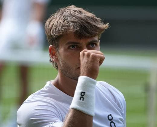 Tennis - 2025 Wimbledon Championships - Men™s singles- Quarter Final - Flavio Cobolli v Novak Djokovic All England Lawn Tennis & Croquet Club - Wednesday 9th July 2025 Flavio Cobolli of Italy celebrates winning the first set 