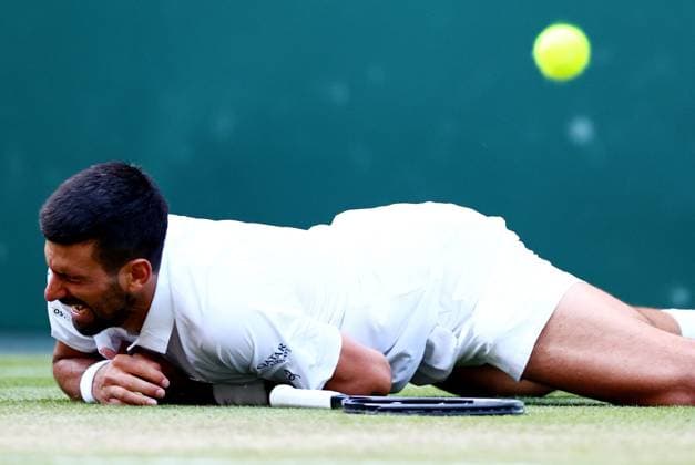 Novak Djokovic falls on match point during his quarter final match Wimbledon Tennis Championships, Day 10, The All England Lawn Tennis and Croquet Club, London, UK - 09 Jul 2025London The All England Lawn Tennis and United Kingdom  Copyright: xJamesxMarsh Shutterstockx 15389394id