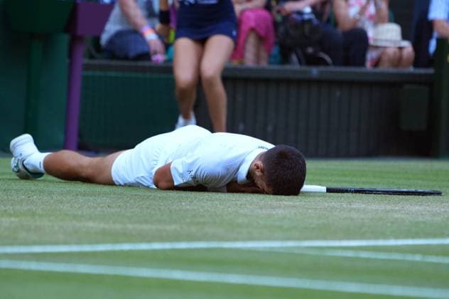 Tennis - 2025 Wimbledon Championships - Men™s singles- Quarter Final - Flavio Cobolli v Novak Djokovic All England Lawn Tennis & Croquet Club - Wednesday 9th July 2025 Novak Djokovic slips on the grass 