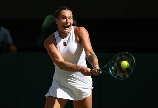Aryna Sabalenka plays a backhand in her Semi-Final match against American Belarusian Amanda Anisimova on day ten of the 2025 Wimbledon Championships in London on Thursday, July 10, 2025. Anisimova won the match 6-4,4-6,6-4.  LON2025071016 HUGOxPHILPOTT