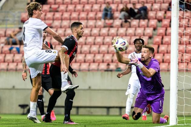 250710 Silas Andersen of Häcken and goalkeeper Ziga Frelih of Spartak Trnava during the UEFA Europa League qualifier football match between Spartak Trnava and Häcken on July 10, 2025 in Trnava. Photo: Mathilda Schuler BILDBYRAN kod MA MA0843 fotboll football soccer fotball uefa europa league europa league spartak trnava häcken bbeng Copyright: MATHILDAxSCHULER BB250710MA130