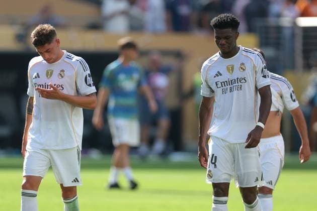 New Jersey, USA, 9th July 2025. Federico Valverde and Aurelien Tchouameni of Real Madrid react after the 4-0 defeat as they leave the field of play following the final whistle of the Paris Saint Germain vs Real Madrid FIFA Club World Cup Semi Final match at Metlife Stadium, New Jersey. Picture credit should read: Jonathan Moscrop Sportimage EDITORIAL USE ONLY. No use with unauthorised audio, video, data, fixture lists, club league logos or live services. Online in-match use limited to 120 images, no video emulation. No use in betting, games or single club league player publications. SPI_193_JM_PSG_REALMADRID_ SPI-4012-0193