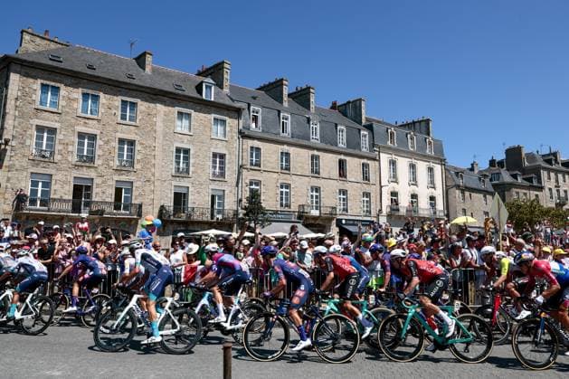The pack of riders pictured in action during stage seven of the 2025 Tour de France cycling, from Saint-Malo to Mur-de-Bretagne (194 km), on Friday 11 July 2025 in France. The 112th edition of the Tour de France starts on Saturday 5 July in Lille, France, and will finish in Paris, France on the 27th of July. POOLxLUCAxBETTINI  x128895778x