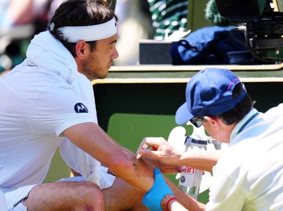 Taylor Fritz receives treatment for a cut during his semi final match Wimbledon Tennis Championships, Day 12, The All England Lawn Tennis and Croquet Club, London, UK - 11 Jul 2025London The All England Lawn Tennis and United Kingdom  Copyright: xJavierxGarcia Shutterstockx 15392287am