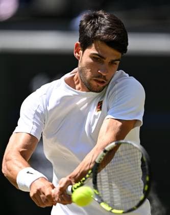 (250711) -- LONDON, July 11, 2025 -- Carlos Alcaraz hits a return during the men s singles semifinal match between Carlos Alcaraz of Spain and Taylor Fritz of the United States at the Wimbledon Tennis Championships in London, Britain, July 11, 2025. ) (SP)BRITAIN-LONDON-TENNIS-WIMBLEDON-MEN S SINGLES ZhaoxDingzhe 