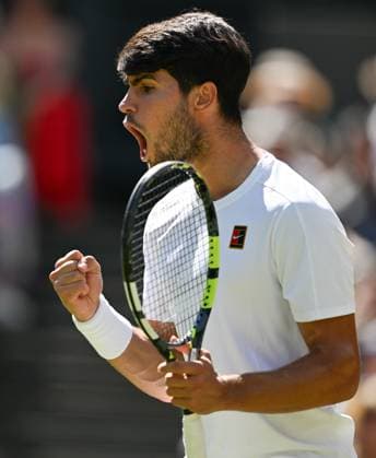 (250711) -- LONDON, July 11, 2025 -- Carlos Alcaraz reacts during the men s singles semifinal match between Carlos Alcaraz of Spain and Taylor Fritz of the United States at the Wimbledon Tennis Championships in London, Britain, July 11, 2025. ) (SP)BRITAIN-LONDON-TENNIS-WIMBLEDON-MEN S SINGLES ZhaoxDingzhe 