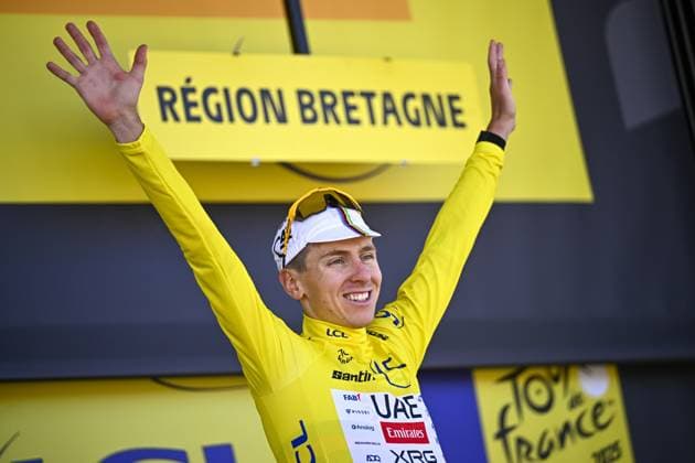 Slovenian Tadej Pogacar of UAE Team Emirates celebrates on the podium in the yellow jersey of leader in the overall ranking after stage seven of the 2025 Tour de France cycling, from Saint-Malo to Mur-de-Bretagne (194 km), on Friday 11 July 2025 in France. The 112th edition of the Tour de France starts on Saturday 5 July in Lille, France, and will finish in Paris, France on the 27th of July. JASPERxJACOBS  x128904707x