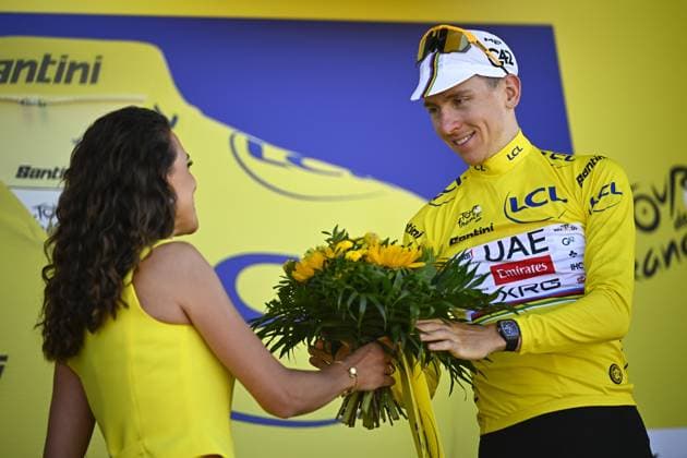 Slovenian Tadej Pogacar of UAE Team Emirates celebrates on the podium in the yellow jersey of leader in the overall ranking after stage seven of the 2025 Tour de France cycling, from Saint-Malo to Mur-de-Bretagne (194 km), on Friday 11 July 2025 in France. The 112th edition of the Tour de France starts on Saturday 5 July in Lille, France, and will finish in Paris, France on the 27th of July. JASPERxJACOBS  x128905099x