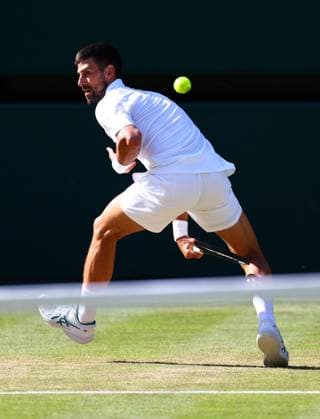 Novak Djokovic hits the ball between his legs during his semi final match Wimbledon Tennis Championships, Day 12, The All England Lawn Tennis and Croquet Club, London, UK - 11 Jul 2025London The All England Lawn Tennis and United Kingdom  Copyright: xJamesxMarsh Shutterstockx 15392288ek