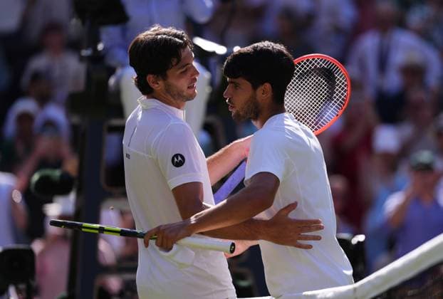 Taylor Fritz of the United States of America (left) and Carlos Alcaraz of Spain shake hands after the Men s Singles Semifinal match on day twelve of The Championships Wimbledon 2025 at All England Lawn Tennis and Croquet Club on July 11, 2025 in London, England.  Copyright: xHiroshixSatox