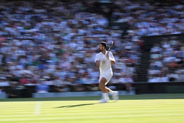 (250712) -- LONDON, July 12, 2025 -- Novak Djokovic competes during the men s singles semifinal match between Jannik Sinner of Italy and Novak Djokovic of Serbia at the Wimbledon Tennis Championships in London, Britain, July 11, 2025. ) (SP)BRITAIN-LONDON-TENNIS-WIMBLEDON-MEN S SINGLES ZhaoxDingzhe 