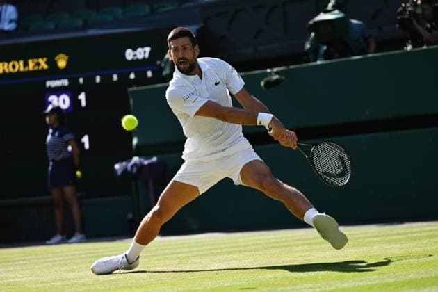 (250712) -- LONDON, July 12, 2025 -- Novak Djokovic hits a return during the men s singles semifinal match between Jannik Sinner of Italy and Novak Djokovic of Serbia at the Wimbledon Tennis Championships in London, Britain, July 11, 2025. ) (SP)BRITAIN-LONDON-TENNIS-WIMBLEDON-MEN S SINGLES ZhaoxDingzhe 