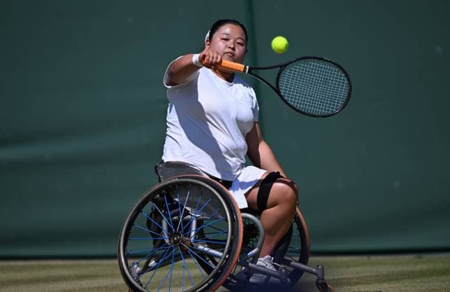 (250712) -- LONDON, July 12, 2025 -- Wang Ziying hits a return during the women s wheelchair singles final between Wang Ziying of China and Kamiji Yui of Japan at the Wimbledon Tennis Championships in London, Britain, July 12, 2025. ) (SP)BRITAIN-LONDON-WHEELCHAIR TENNIS-WIMBLEDON-WOMEN S SINGLES-FINAL LixYing 