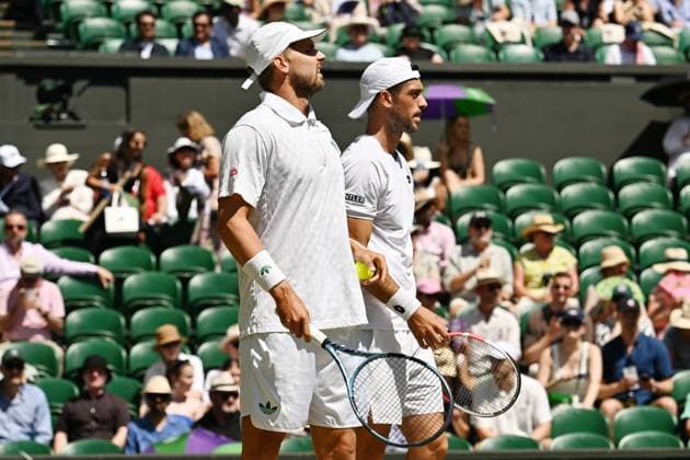 Wimbledon Tennis Championships - Day 13 LONDON, UNITED KINGDOM - JULY 12: Julian Cash and Lloyd Glasspool of United Kingdom in action against Rinky Hijikata of Australia and David Pel of the Netherlands during Championships Wimbledon 2025 Men’s Doubles final tennis match at All England Lawn Tennis and Croquet Club in London, United Kingdom on July 12, 2025. Ray Tang Anadolu London United Kingdom. Editorial use only. Please get in touch for any other usage.  Copyright: x2025xAnadoluxRayxTangx