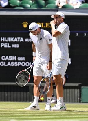 (250712) -- LONDON, July 12, 2025 -- Julian Cash (L) Lloyd Glasspool react during the men s doubles final between Rinky Hijikata (Australia) David Pel (the Netherlands) and Julian Cash Lloyd Glasspool of Britain at the Wimbledon Tennis Championships in London, Britain, July 12, 2025. ) (SP)BRITAIN-LONDON-TENNIS-WIMBLEDON-MEN S DOUBLES-FINAL ZhaoxDingzhe 