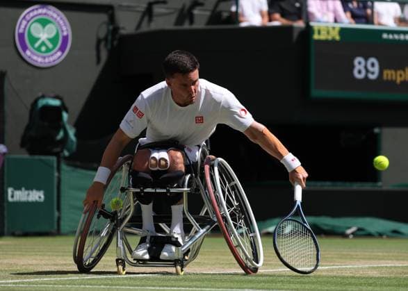 12th July 2025; All England Lawn Tennis and Croquet Club, London, England; Wimbledon Tennis Tournament, Day 13; Gordon Reid (GBR) with a backhand shot to Martin De La Puente (ESP) in their men s wheelchair doubles final  ActionPlus12812506 JohnxPatrickxFletcher